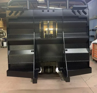 Large black powder-coated fabricated guard assembly in the Clark's shop