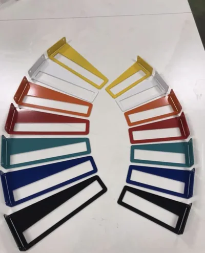 Powder-coated metal sample pieces arranged in multiple colours