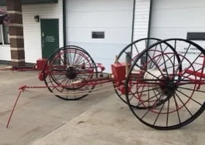 Restored red and black vintage wheeled equipment