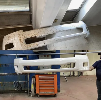 Before-and-after comparison of a weathered vehicle bumper and its white powder-coated finish