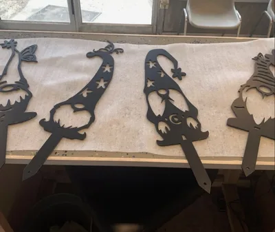 Black powder-coated decorative gnome-shaped metal cutouts