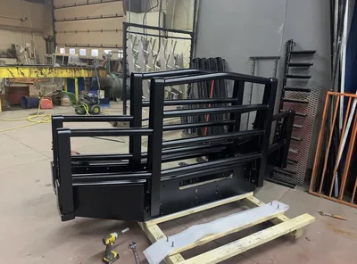 Large black powder-coated guard assembly in the Clark's shop