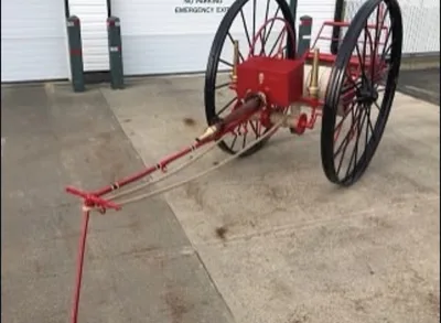 Red and black restored vintage wheeled equipment