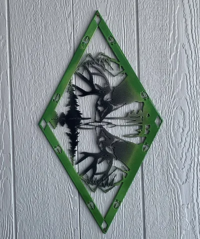 Green and black powder-coated wildlife metal wall art mounted on a wall
