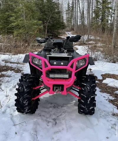 Front view of ATV with vivid pink powder-coated front rack and trim
